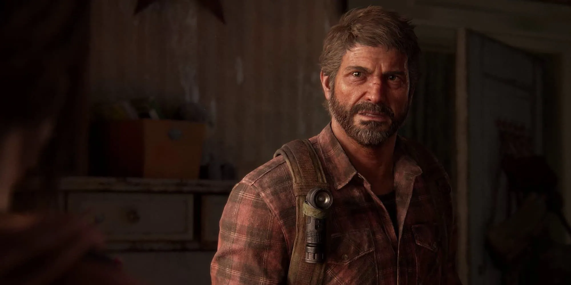 Cảnh game The Last of Us Part 1 với đồ họa hiện đại, nhân vật Ellie và Joel trong môi trường hậu tận thế