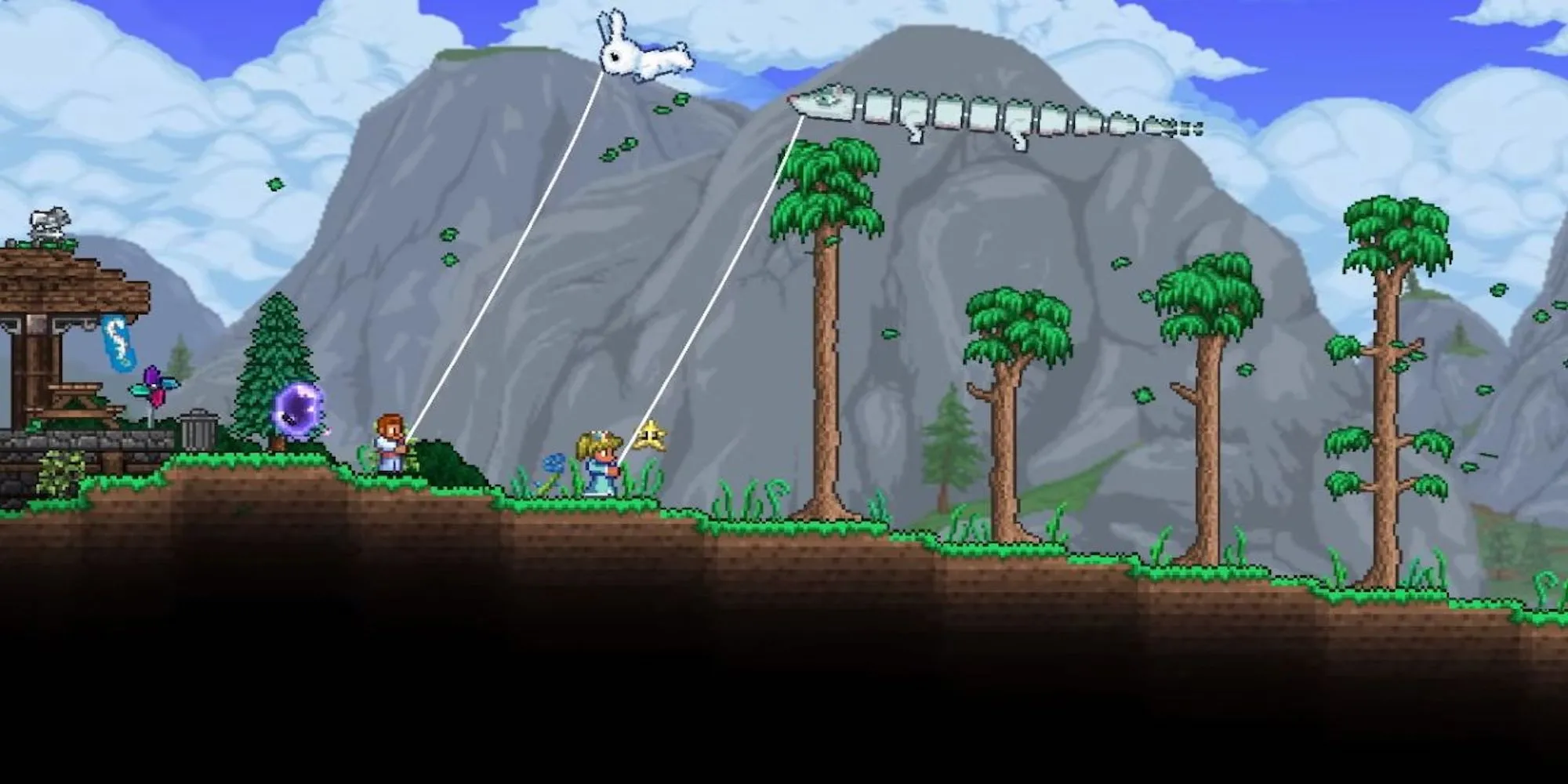 Hai người chơi Terraria đang thả diều trong một thế giới pixel đầy màu sắc