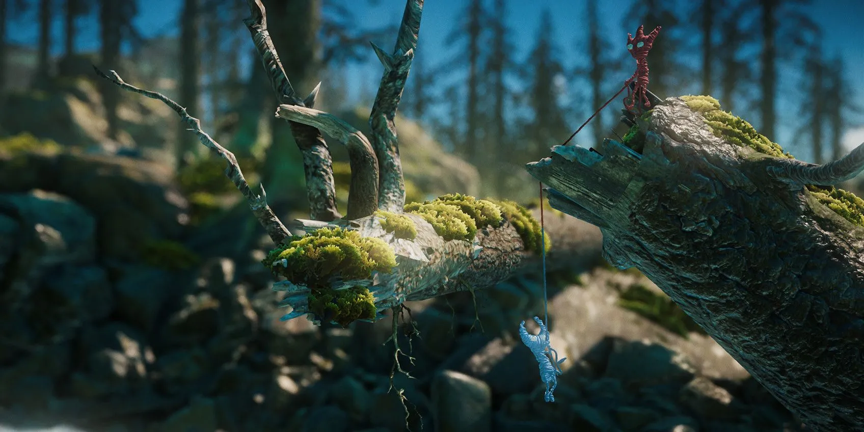 Hai nhân vật Yarny giúp đỡ lẫn nhau trong game Unravel Two