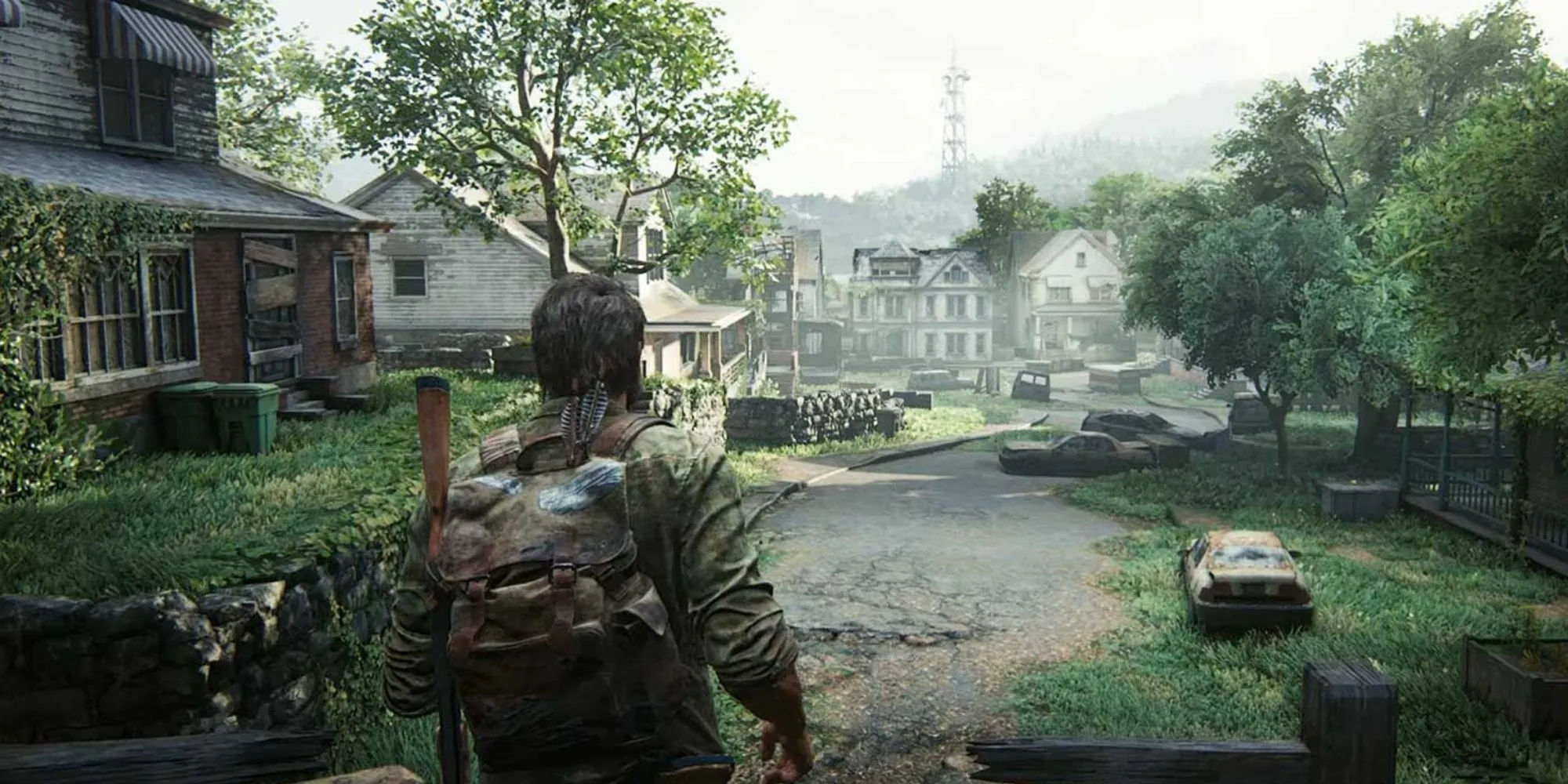 Joel và Ellie lặng lẽ bước qua một thị trấn bị bỏ hoang trong The Last of Us Part 1