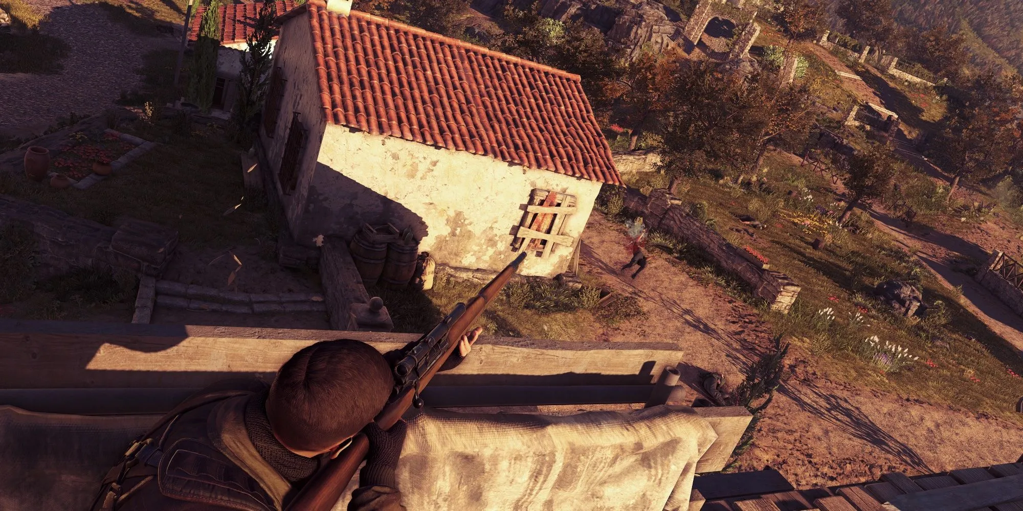 Karl Fairburne ẩn mình trên mái nhà ngắm bắn kẻ thù trong Sniper Elite 4