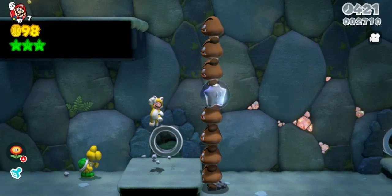 Mario trong bộ đồ mèo đang khám phá một màn chơi đầy màu sắc trong Super Mario 3D World
