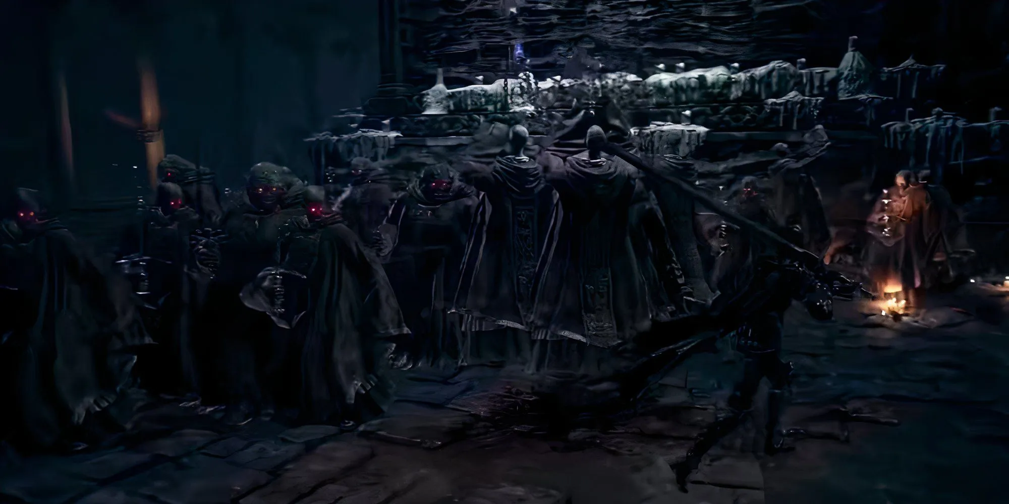 Một nhóm Deacons of the Deep trong Dark Souls 3 đang tụ tập trong một nhà thờ lớn, một trong số đó phát sáng đỏ.