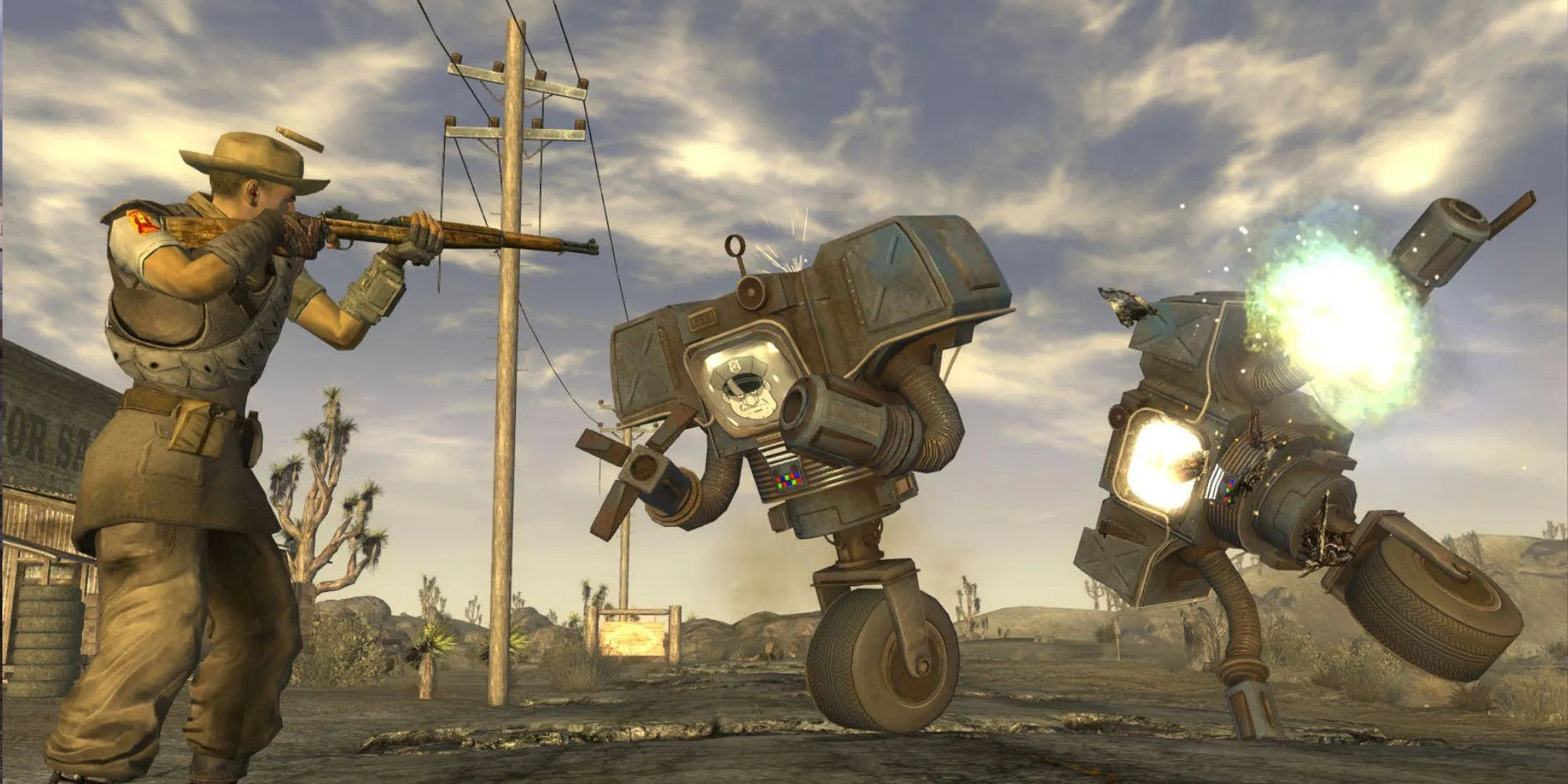 Nhân vật chĩa súng vào robot trong bối cảnh hậu tận thế của Fallout New Vegas