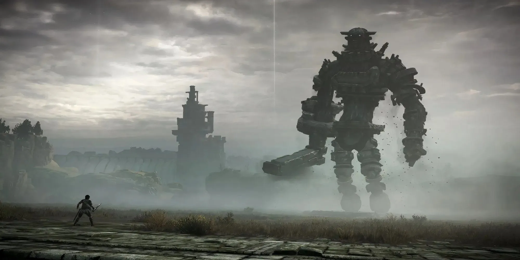 Nhân vật Wander chuẩn bị đối đầu với một Colossus khổng lồ trong game Shadow of the Colossus