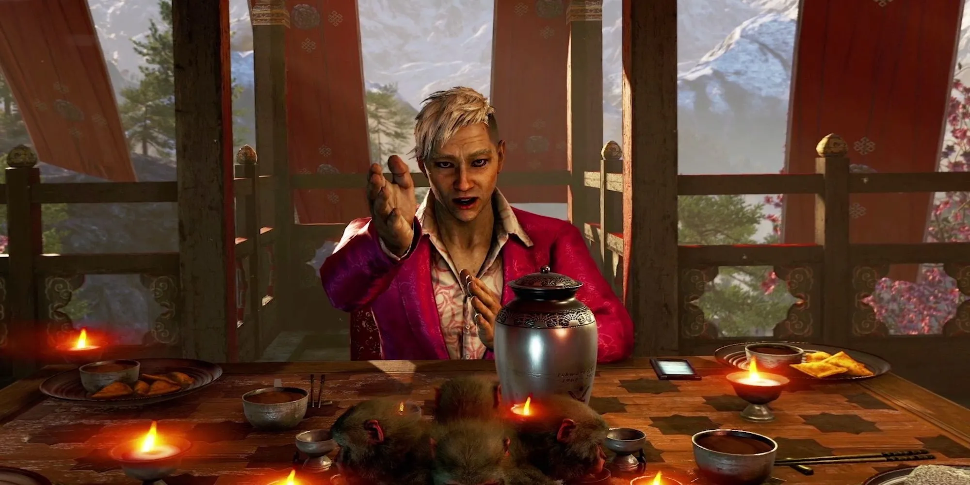 Pagan Min trong Far Cry 4 đang ra hiệu với người chơi, mặc bộ vest màu hồng đặc trưng.