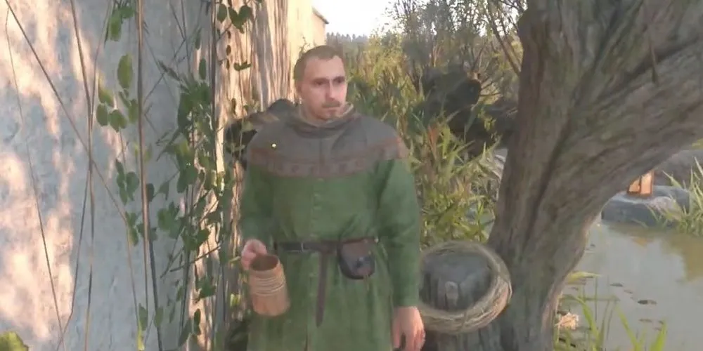 Vostatek uống rượu bên ao trong Kingdom Come Deliverance 2