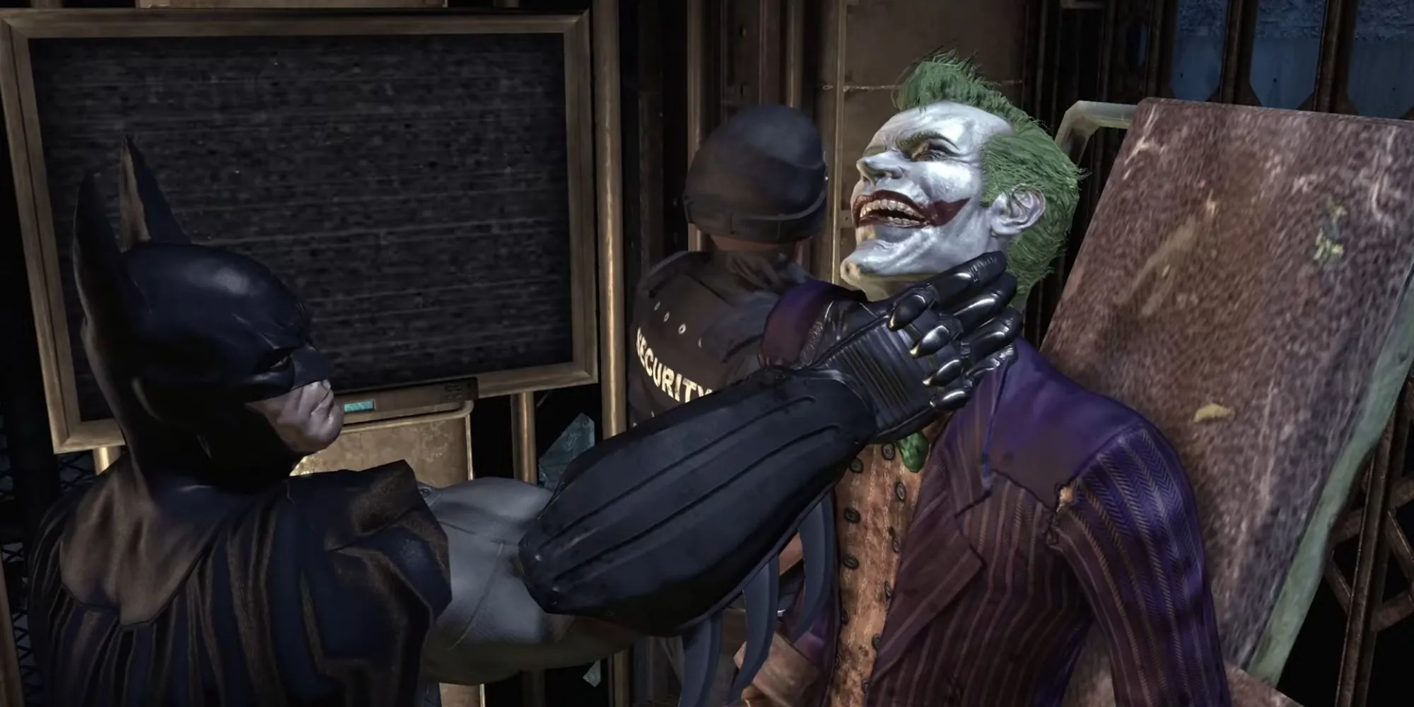 Batman đang giữ cổ Joker khi hắn được chuyển đến phòng giam trong Batman Arkham Asylum