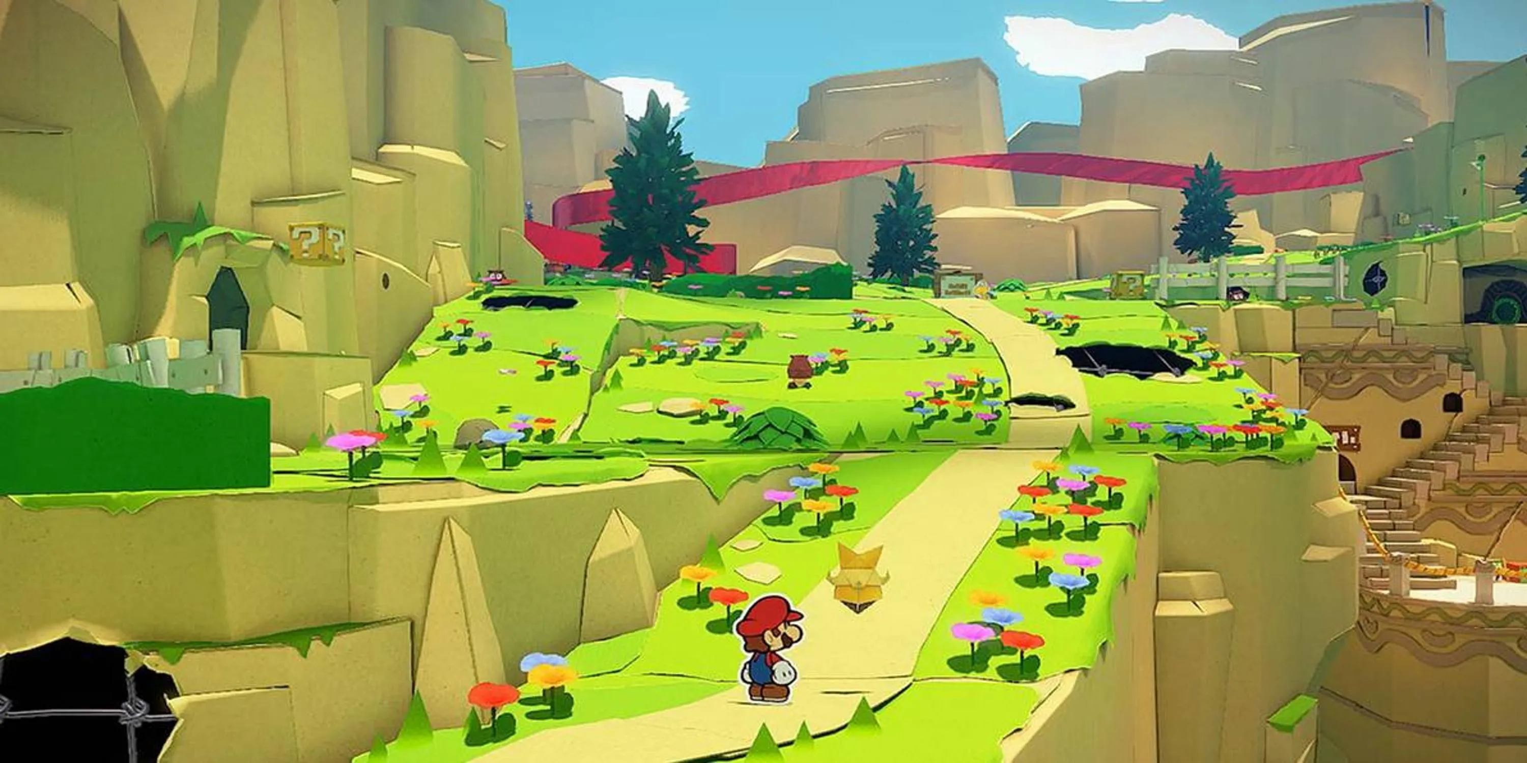 Mario đứng trên con đường dẫn lên đồi, phong cách đồ họa độc đáo của Paper Mario The Origami King