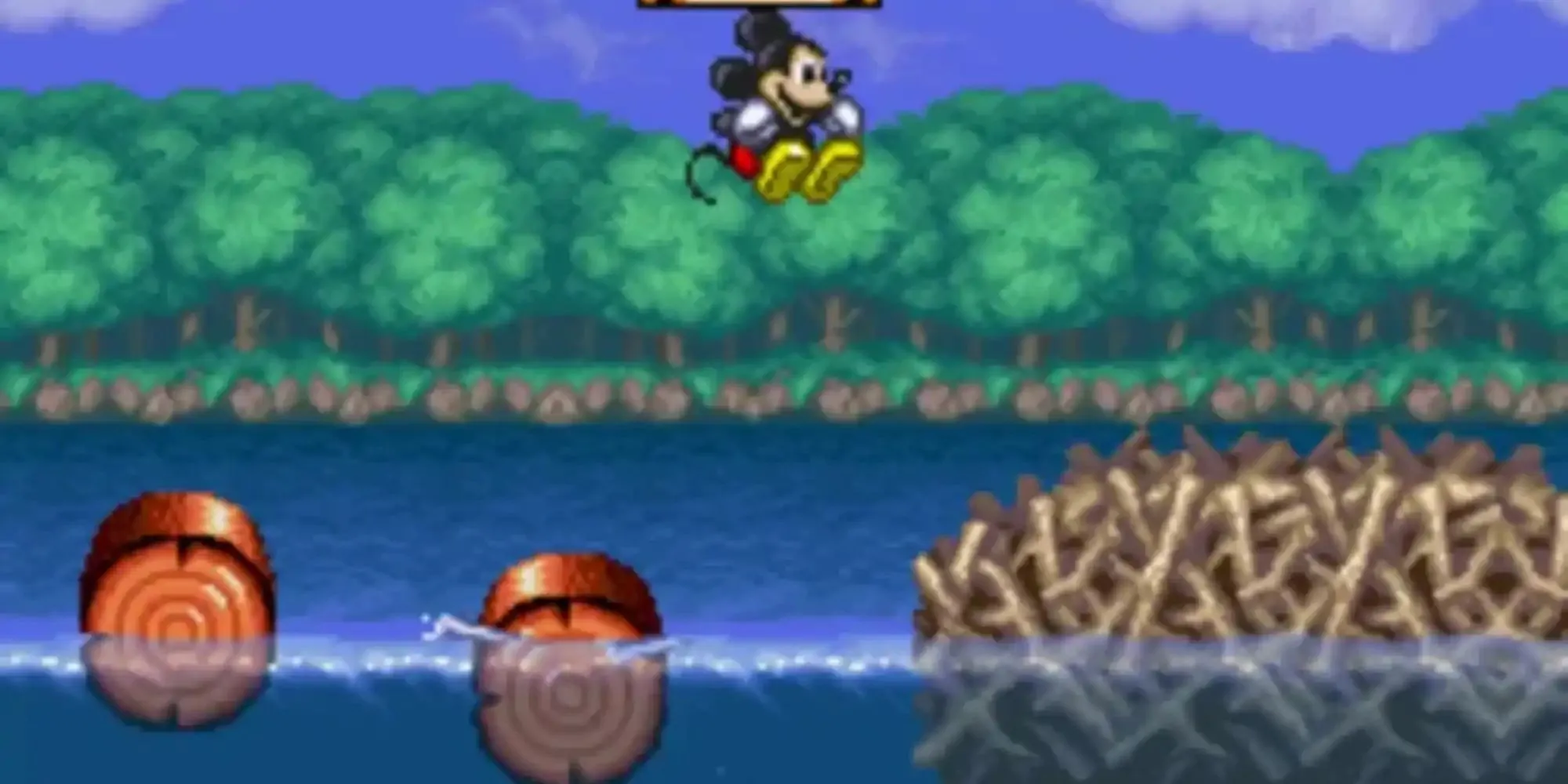Mickey Mouse trong trang phục pháp sư ở game Magical Quest trên SNES