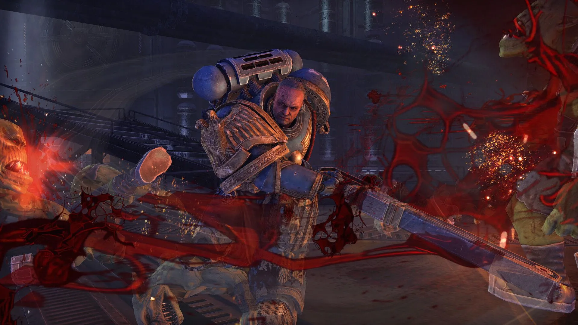 Space Marine sử dụng Chainsaw Sword để tiêu diệt Orks trong Warhammer 40,000 Space Marine Master Crafted Edition